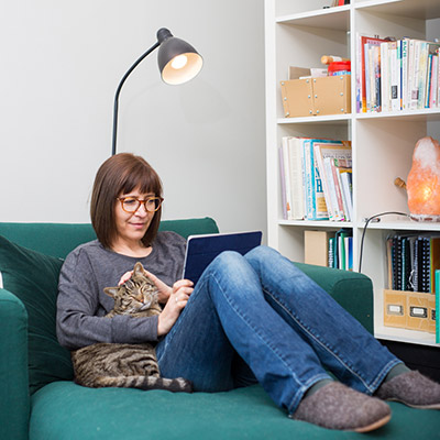 Lady studying with her cat